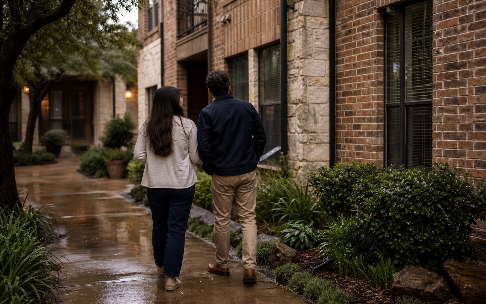 A brick residential property in Houston after rain